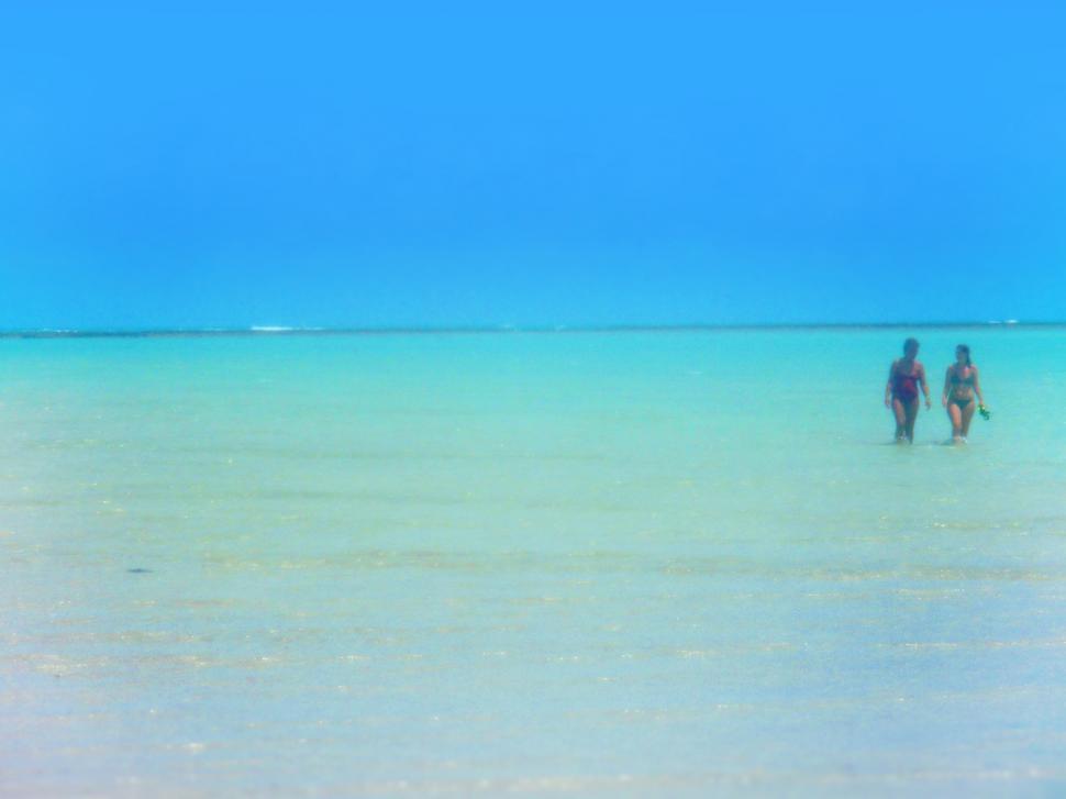 Free Image of Two Women on the Beach - Hazy Vintage Washed-out Looks 