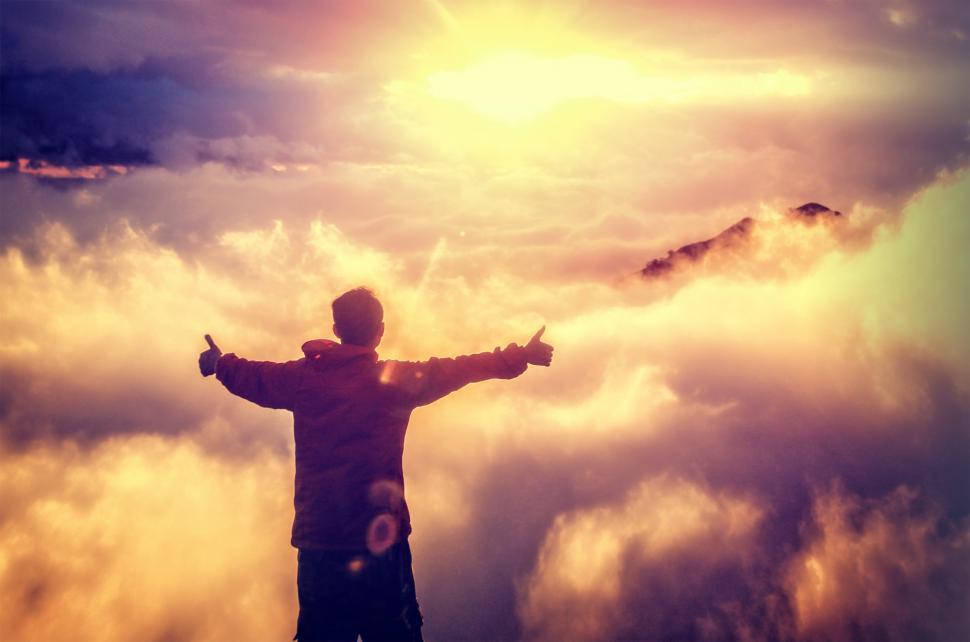Free Image of Man Standing on the Top of the Mountain Above the Clouds - Victo 