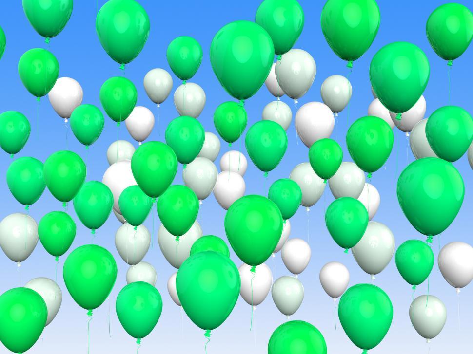 Free Image of Floating Green And White Balloons Mean Freedom And Eco Friendly 