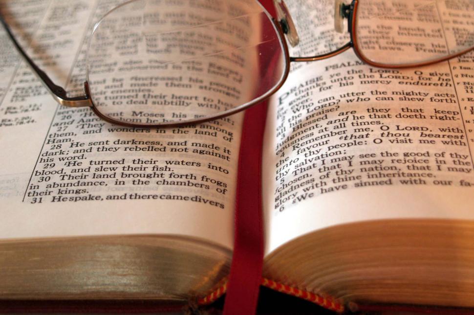 Free Image of Glasses Resting on Open Book. 