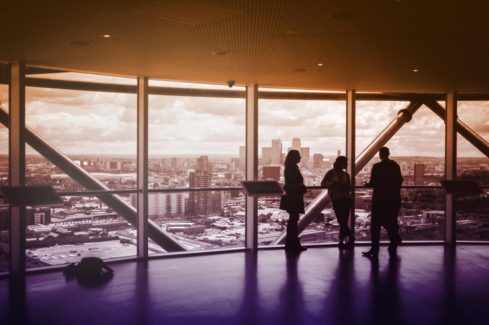 Free Image of People Enjoying the View and Discussing Business 