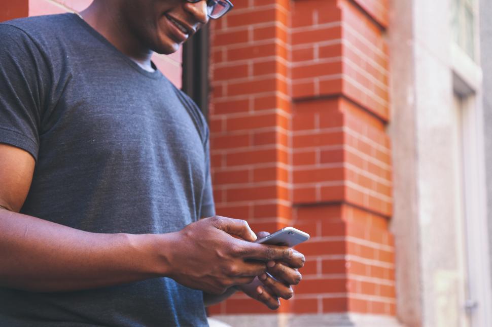 Free Image of Texting on a smart phone 