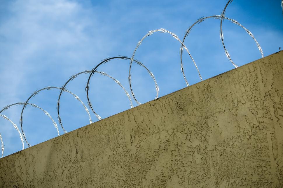 Free Image of Razor wire in top of wall 