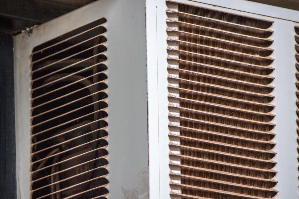 Free Image of AC Grate with compressor in view 