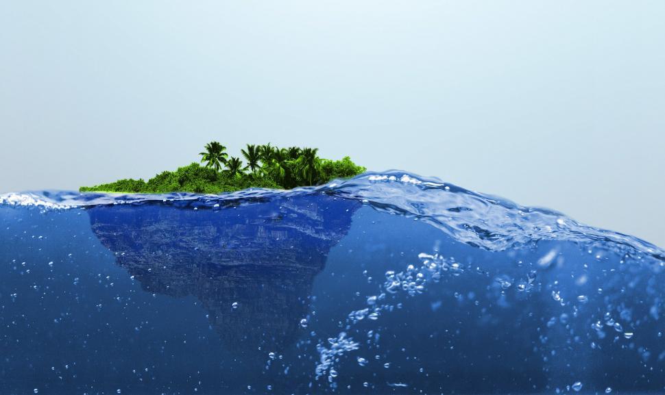 Free Image of Small Island Amidst Vast Ocean 