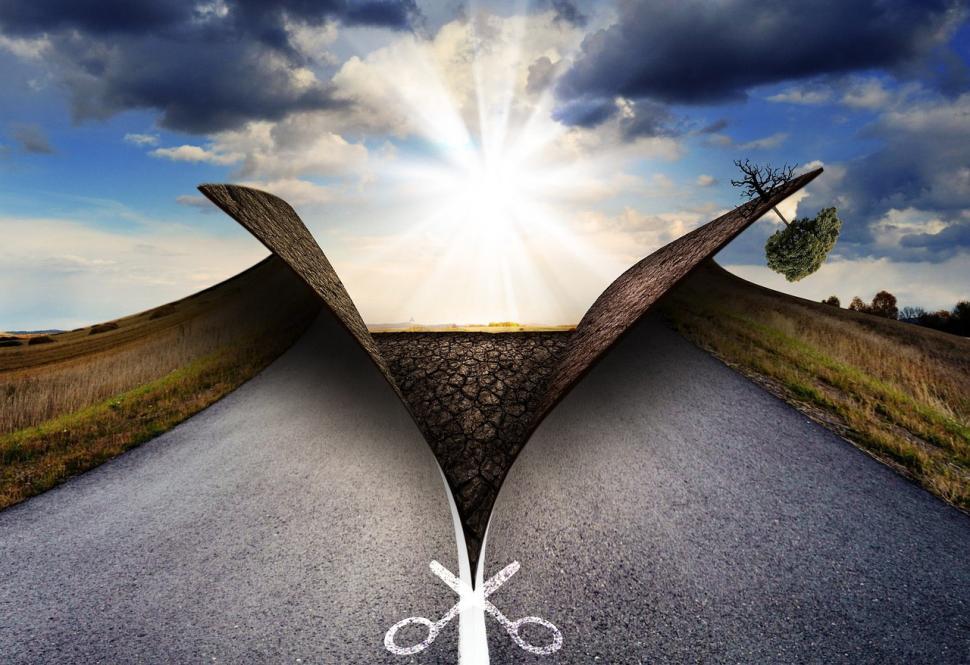 Free Image of Scissors Cutting Through Middle of Road 