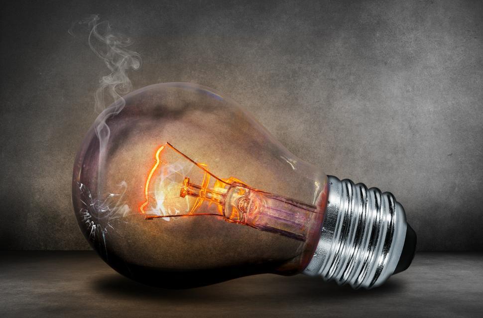 Free Image of Light Bulb Emitting Smoke 