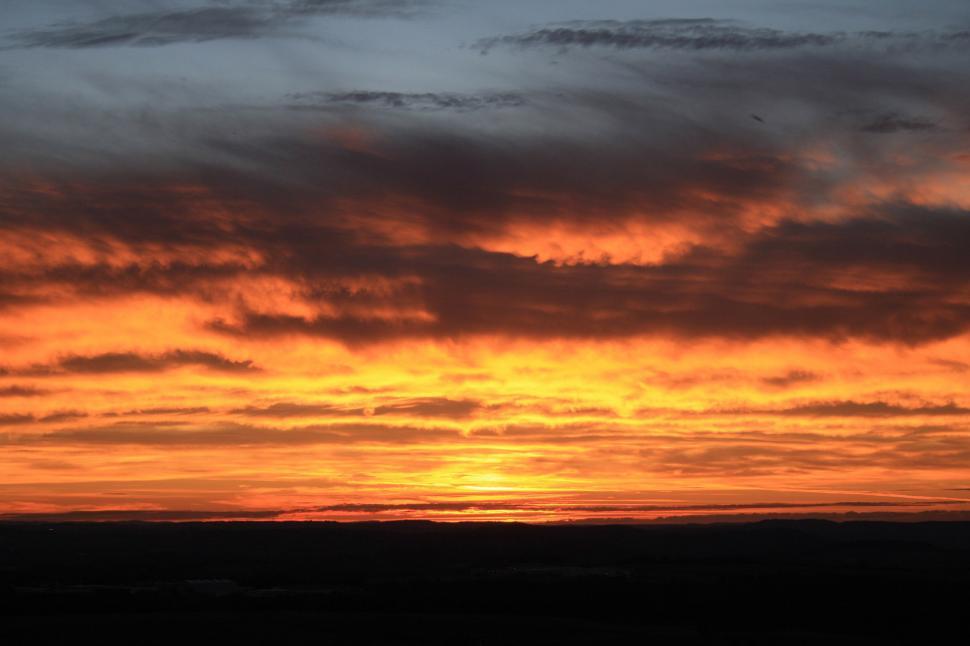 Free Image of A Plane Flying in the Sky at Sunset 