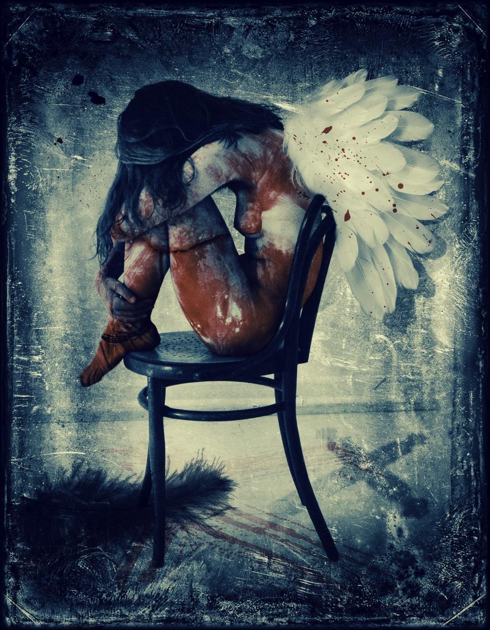 Free Image of Woman Sitting in Chair With Large White Flower on Her Back 