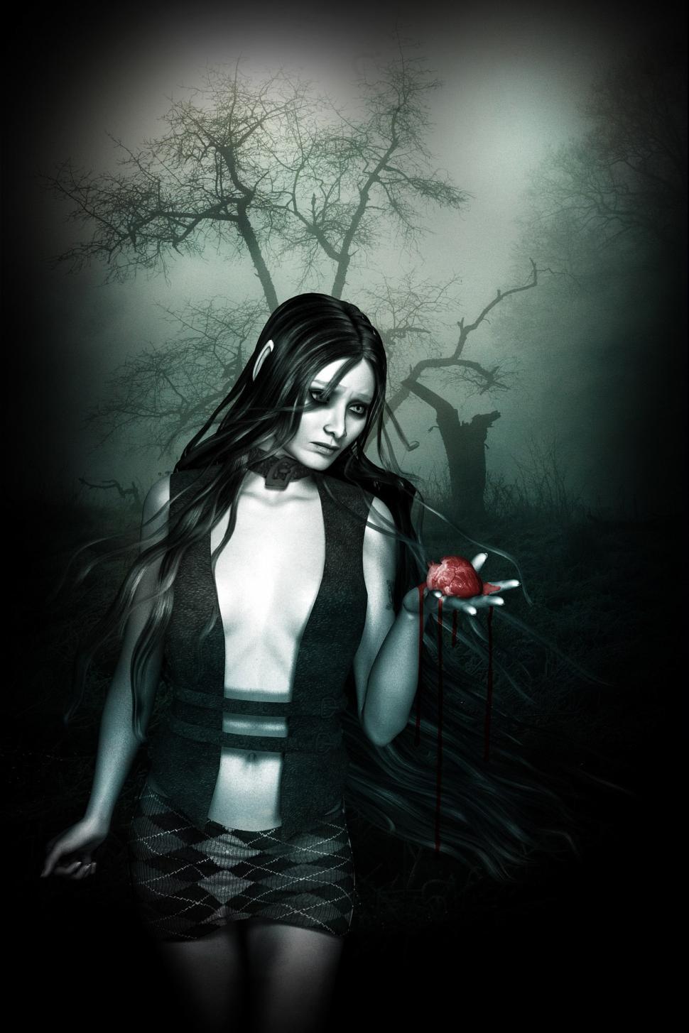 Free Image of Woman With Long Hair Standing in Dark Forest 