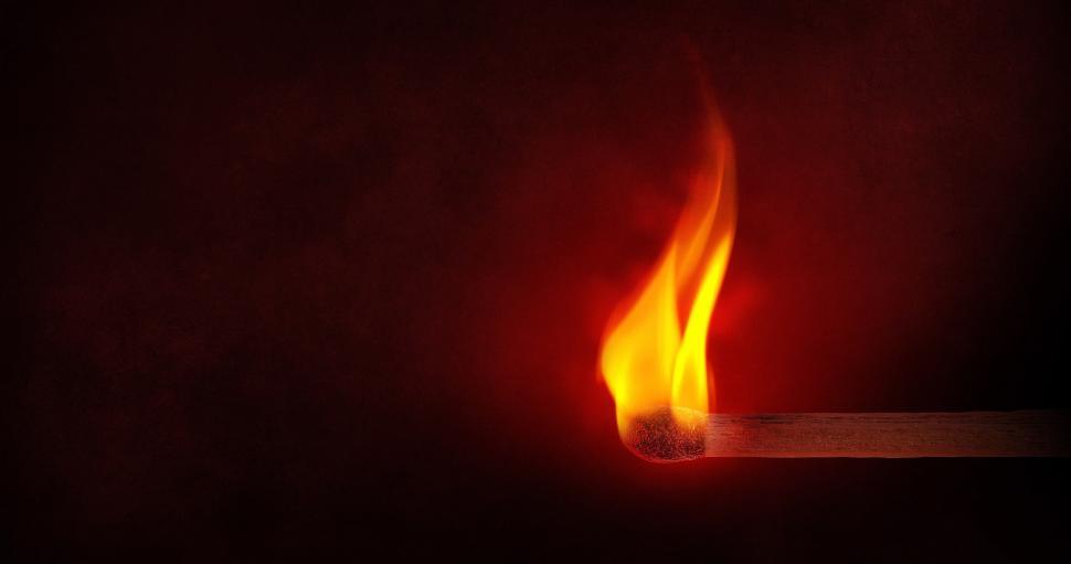 Free Image of Illuminated Matchstick in Dark Room 