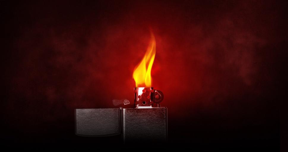 Free Image of Lit Candle on Red Background 
