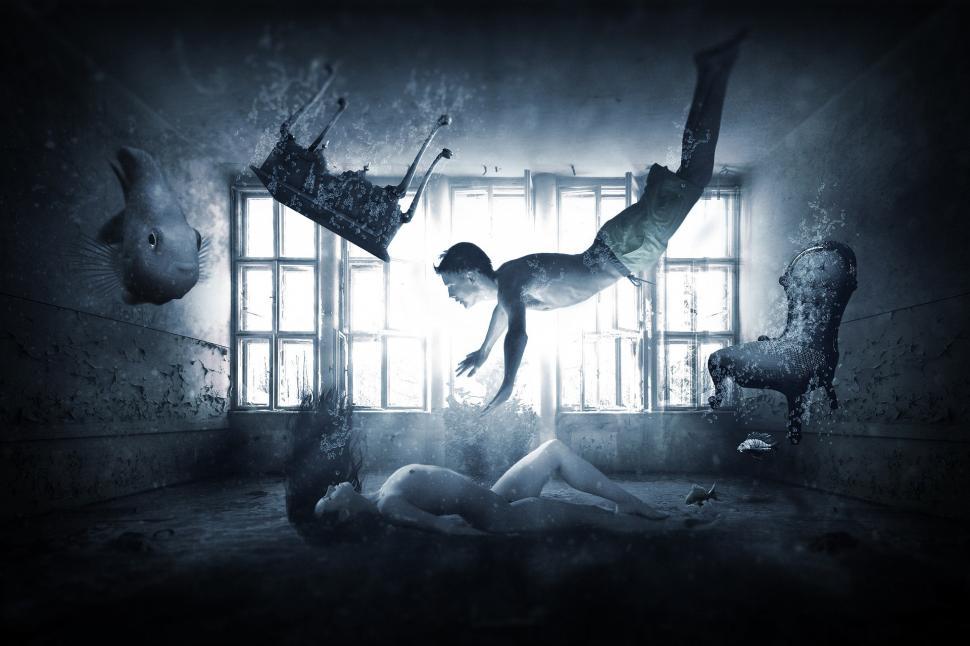 Free Image of Woman Laying on Floor in Front of Window 