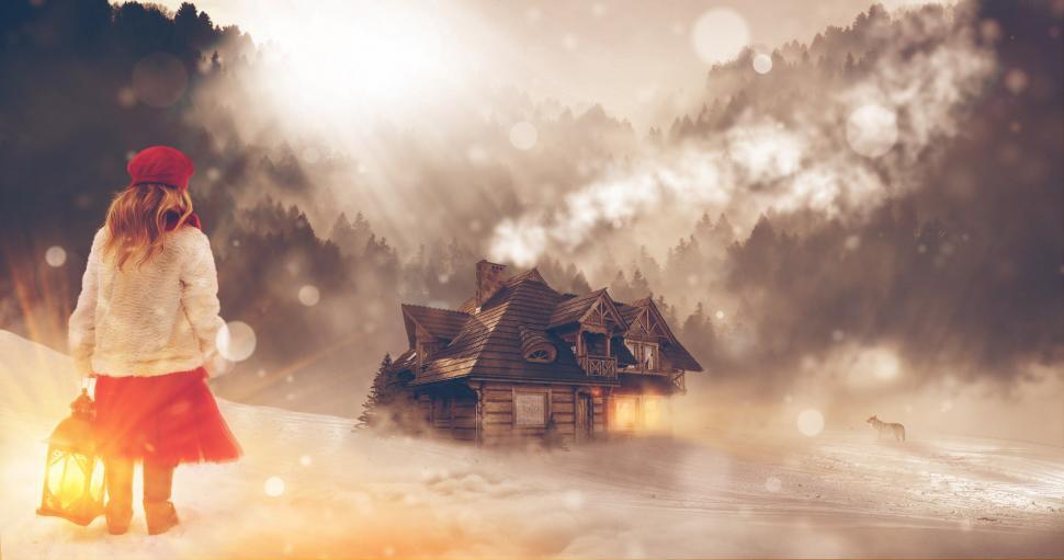 Free Image of Woman Standing in Front of Cabin in Snow 