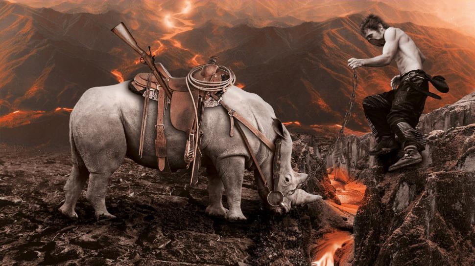 Free Image of Man Standing on Mountain Next to Elephant 