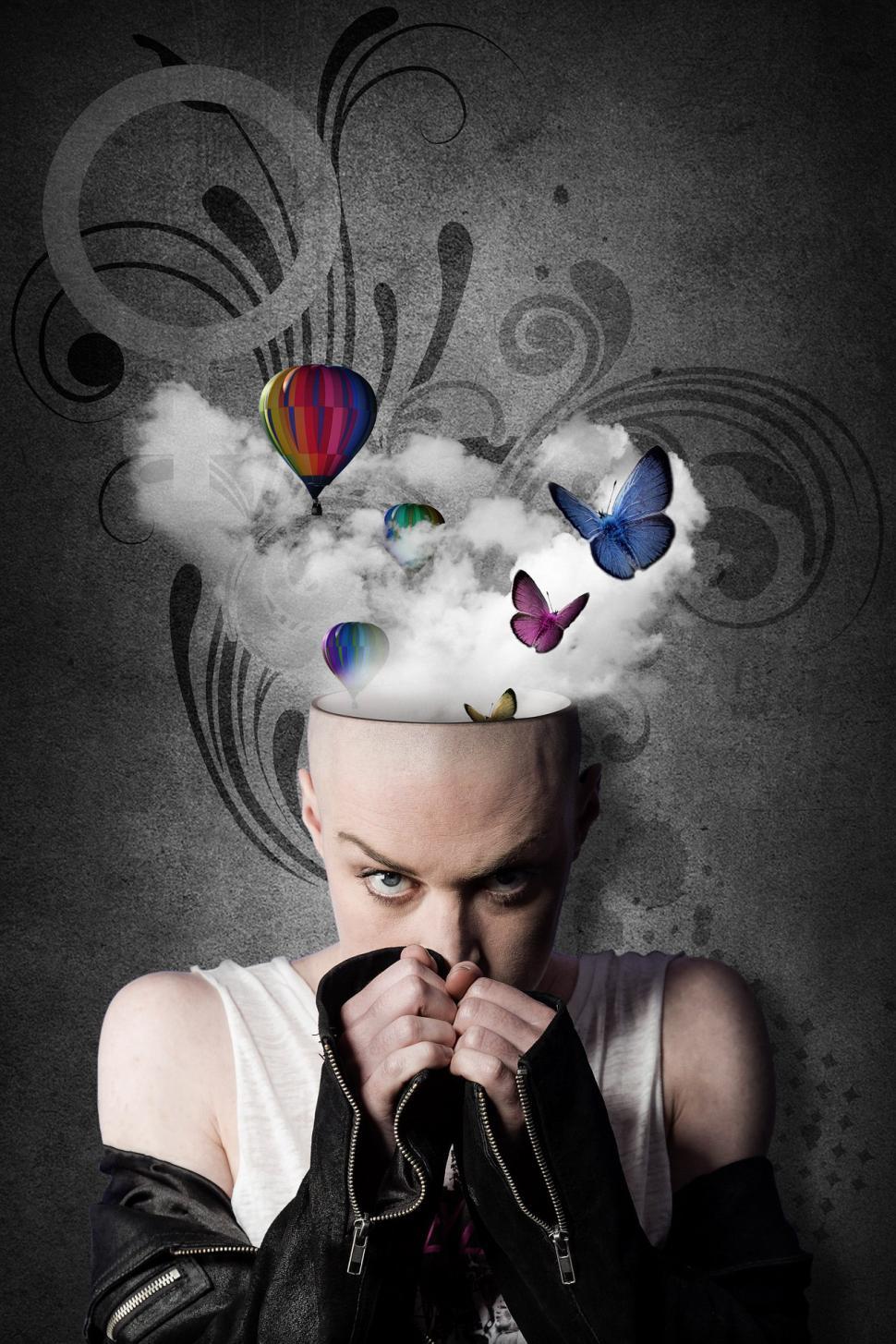 Free Image of Man Surrounded by a Cloud of Butterflies 
