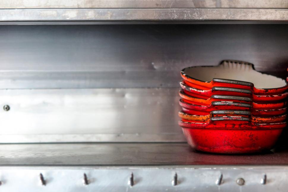 Free Image of Stainless steel shelf with pans 