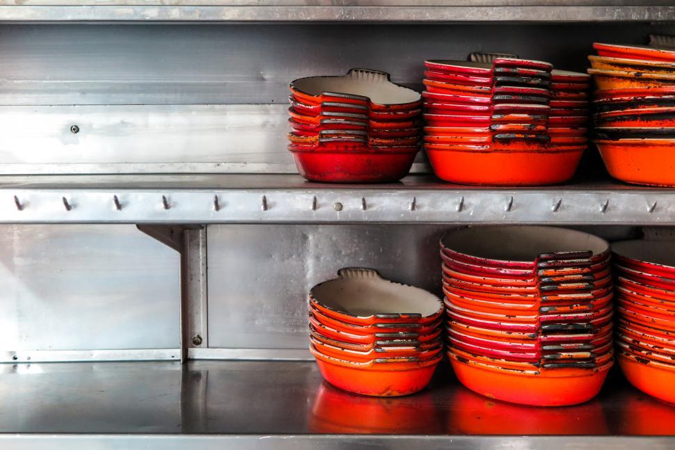 Free Image of Cast Iron skillets on a shelf 