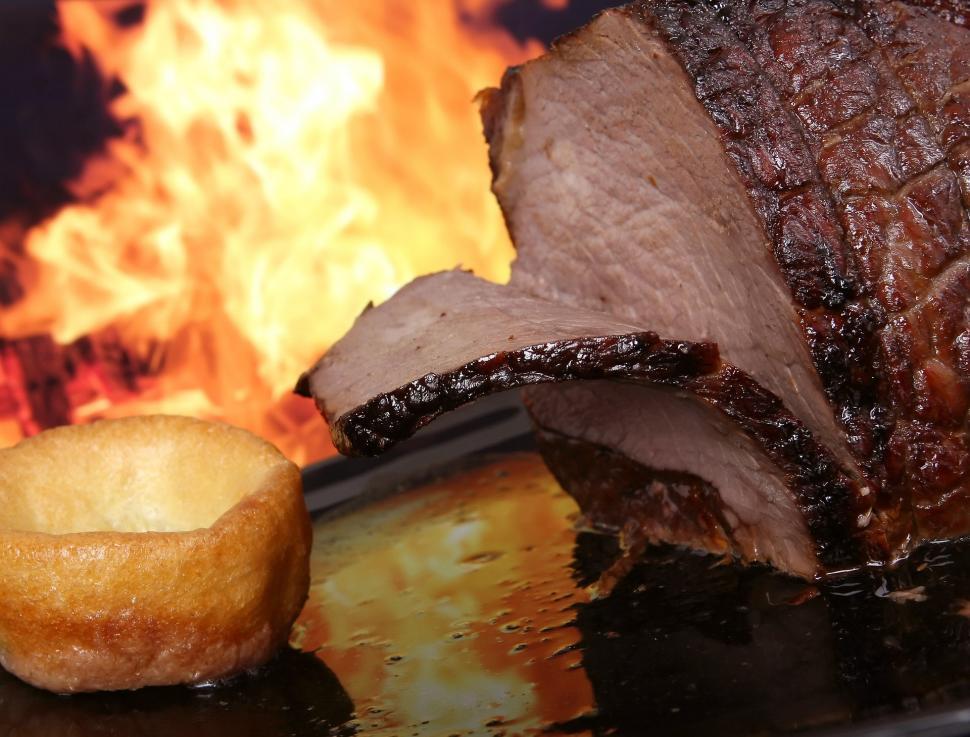Free Image of Plate of Food With Fire in Background 