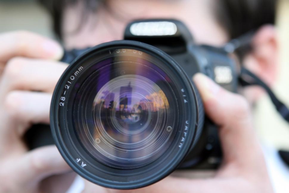 Free Image of Man Taking a Picture With a Camera 