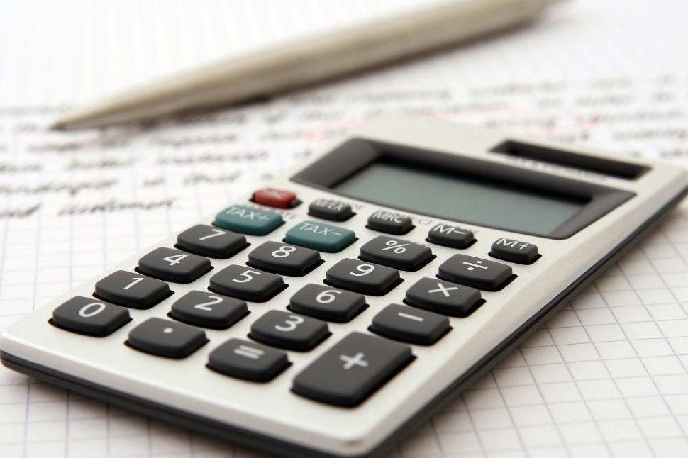 Free Image of Calculator on Top of Paper 