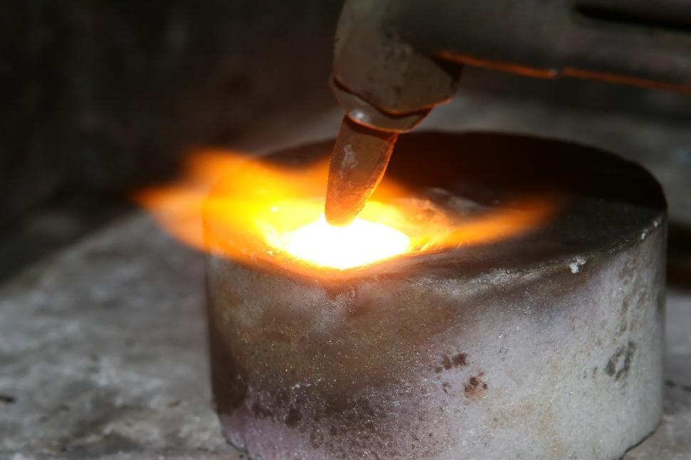 Free Image of Person Using Grinder on Metal Piece 