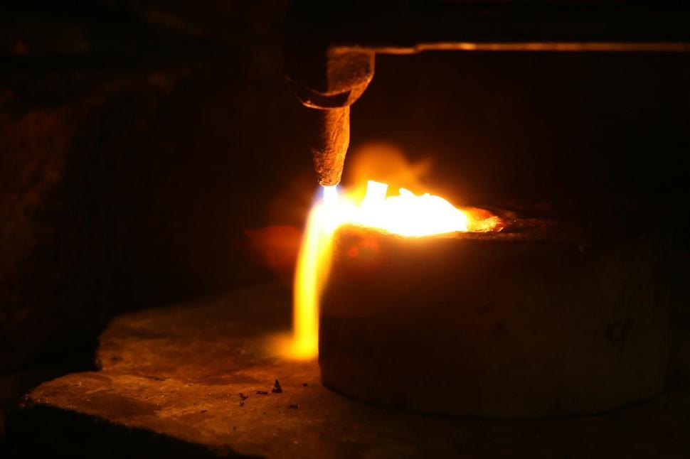 Free Image of A Candle Illuminates a Dark Room 