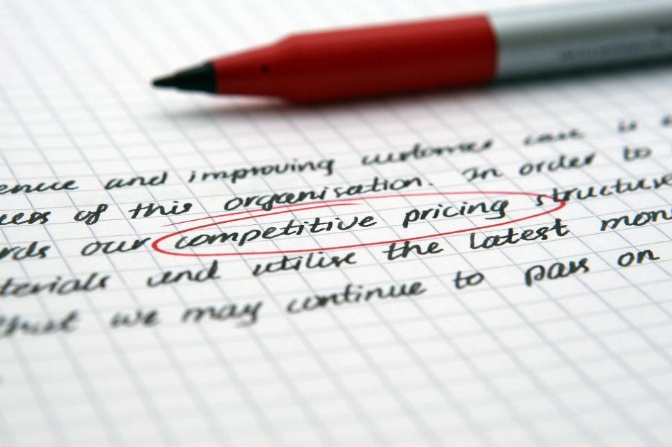 Free Image of Red Pen on Top of Paper 