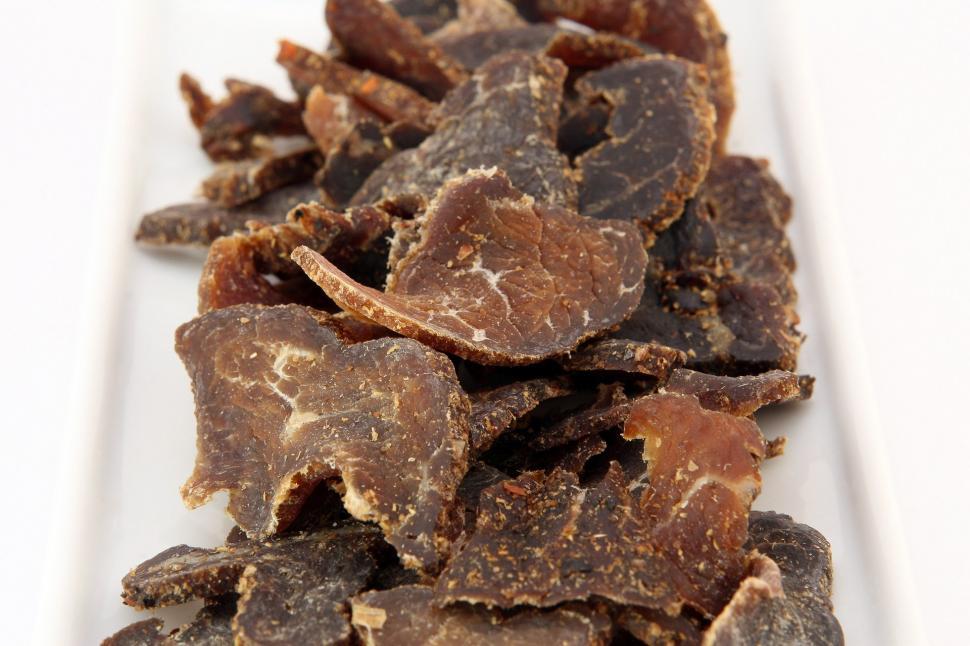 Free Image of White Plate Topped With Chocolate Pieces 