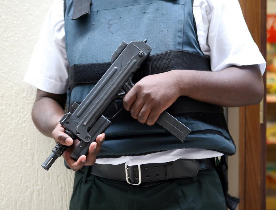 Free Image of Man Holding Gun in Right Hand 
