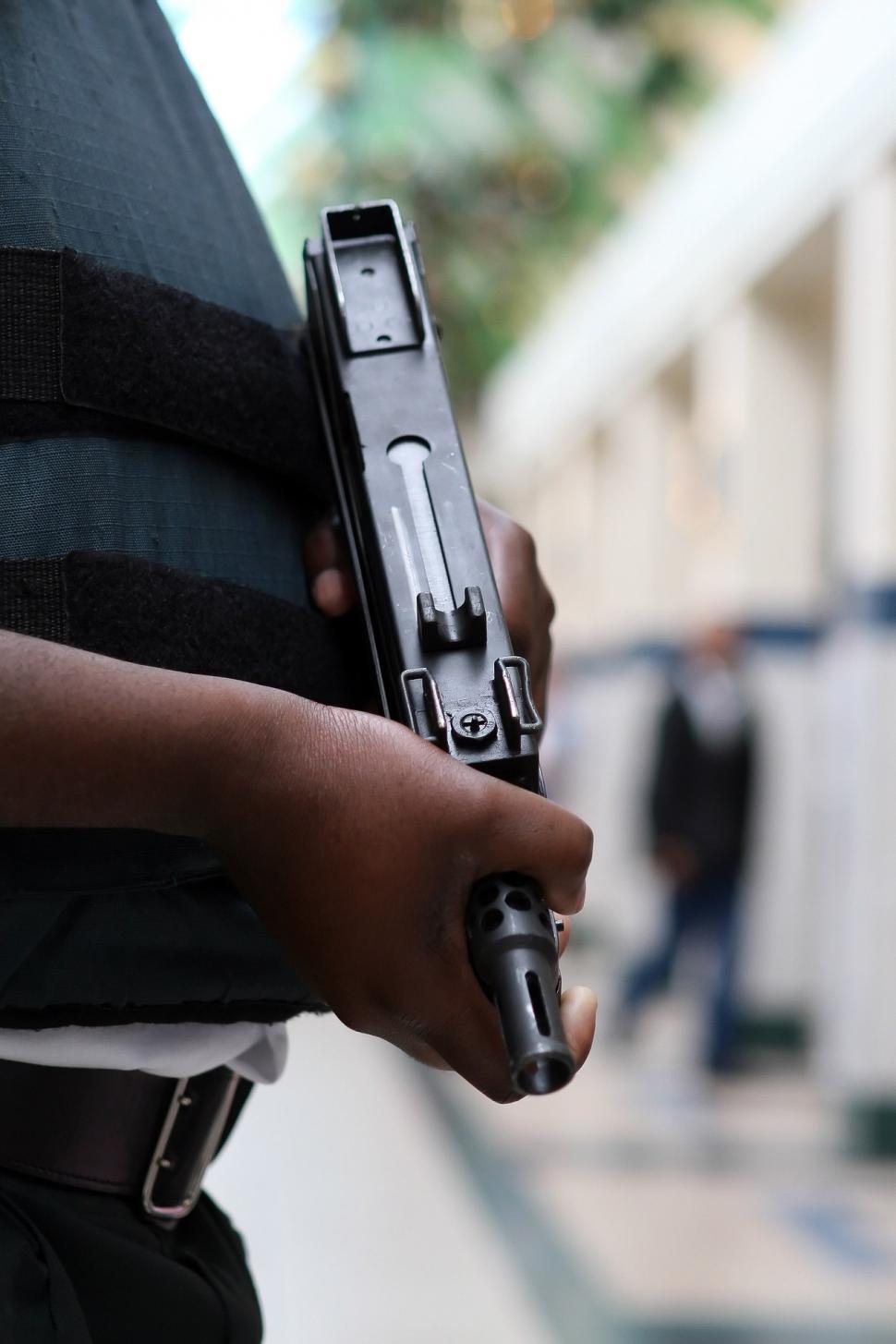 Free Image of Person Holding a Gun Close Up 