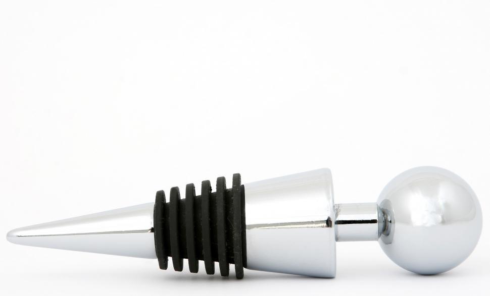 Free Image of Silver Object With Black Tip on White Background 
