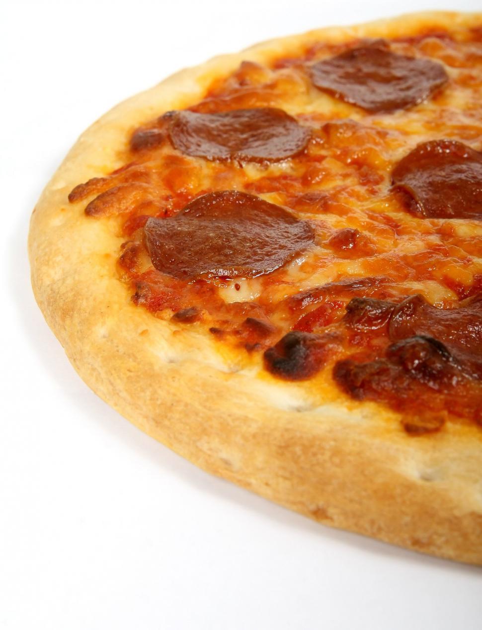 Free Image of Close Up of Pepperoni Pizza on White Surface 