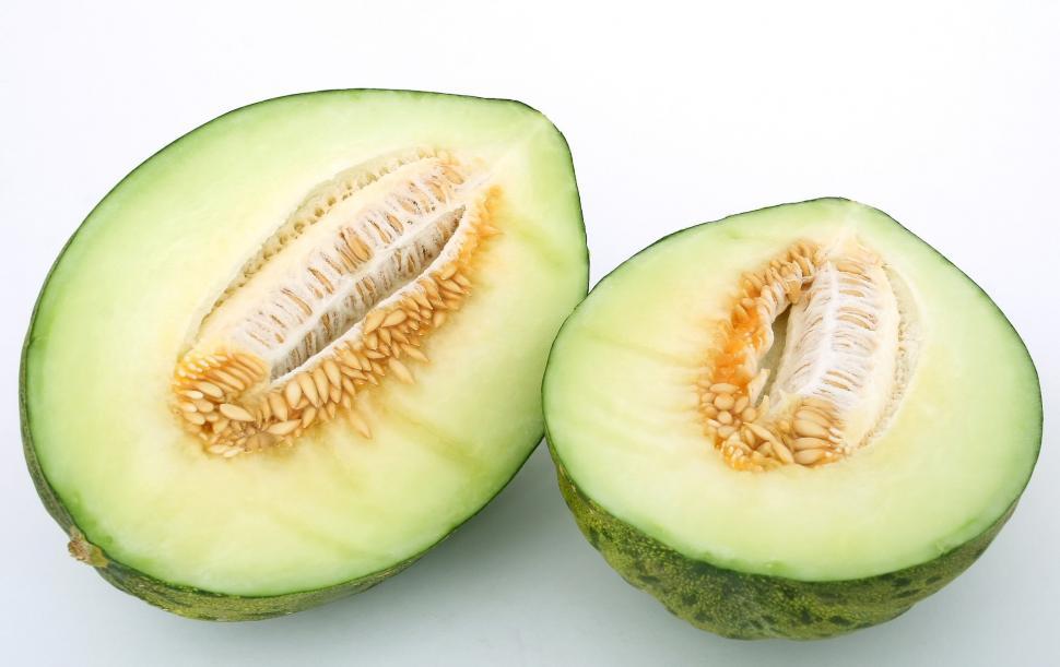 Free Image of Half of an Avocado on White Surface 