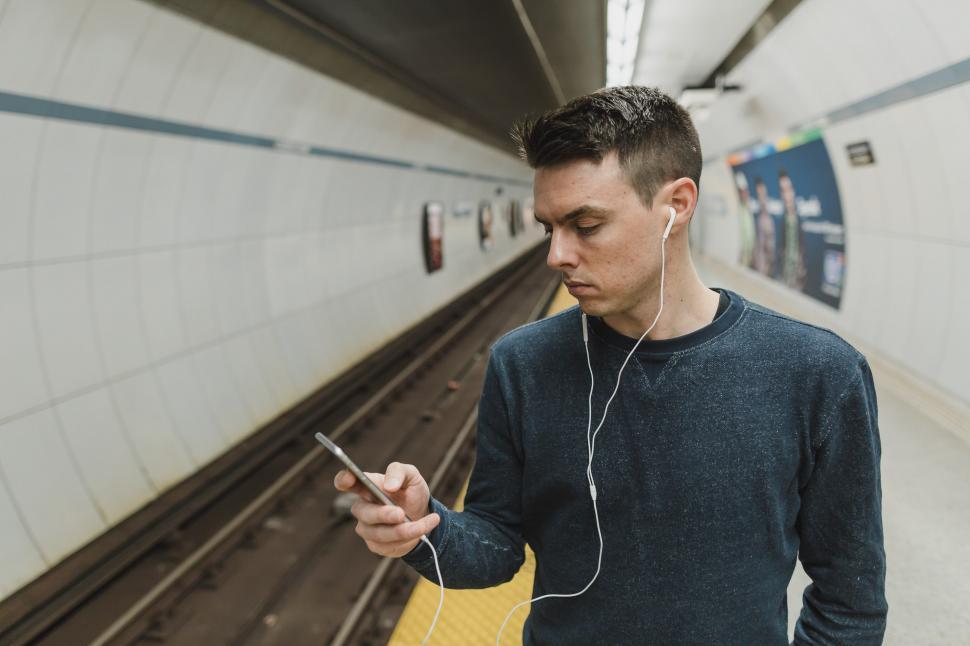 Free Image of Man Using iPhone 
