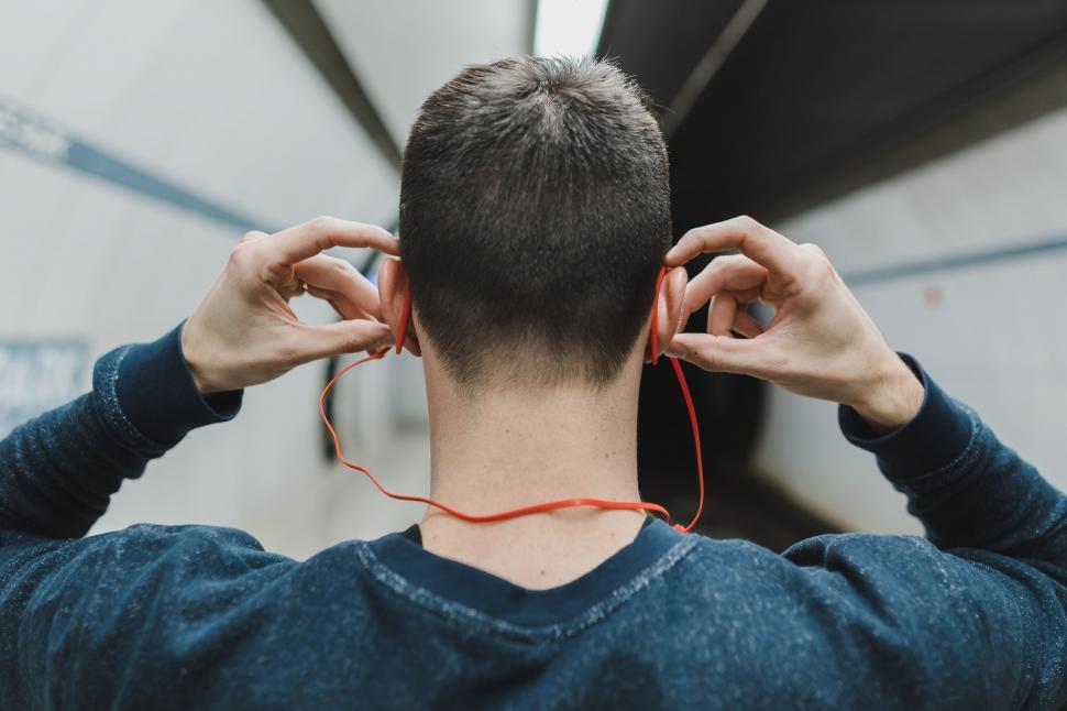 Free Image of Man Wearing Bluetooth Earbuds 