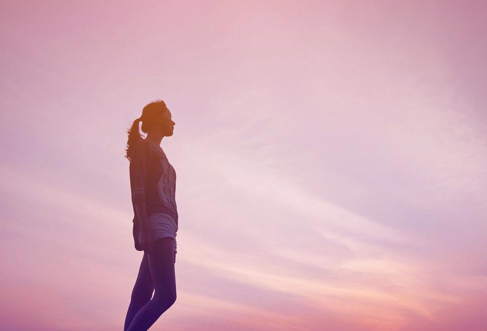 Free Image of Lone Young Girl at Sunset Looking at the Far Horizon 