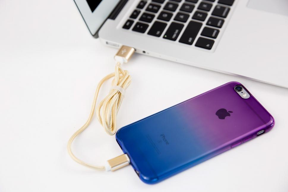 Free Image of Smartphone charging with laptop 