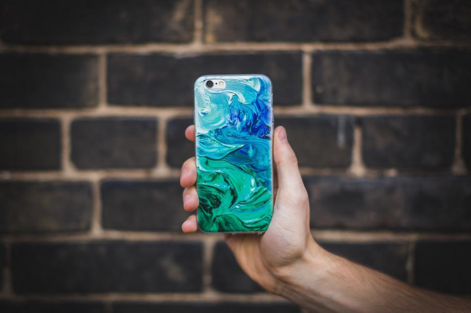 Free Image of Hand Holding Smart Phone Case 