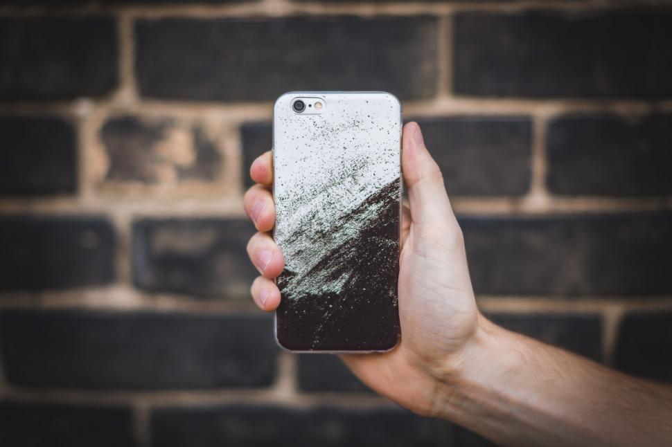 Free Image of Holding iPhone 6 