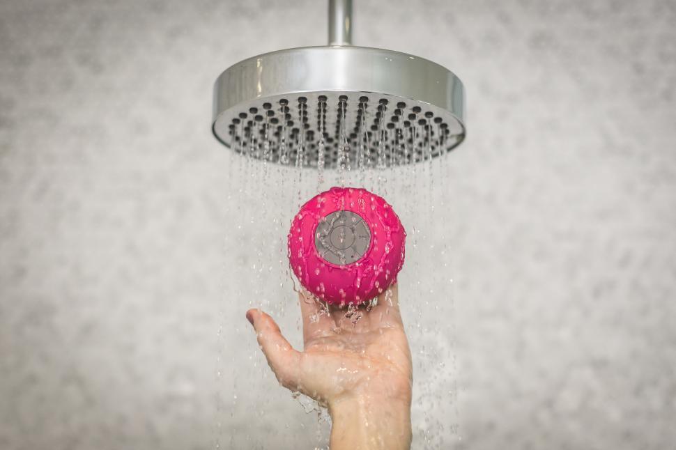 Free Image of Holding Shower Speaker 