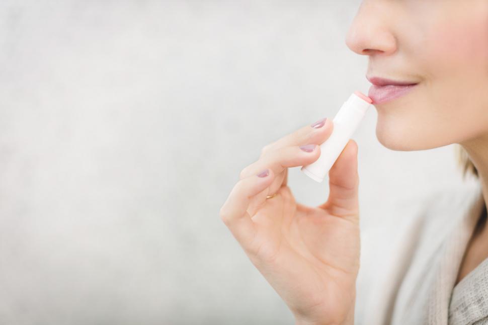 Free Image of Woman Using Lip Balm 