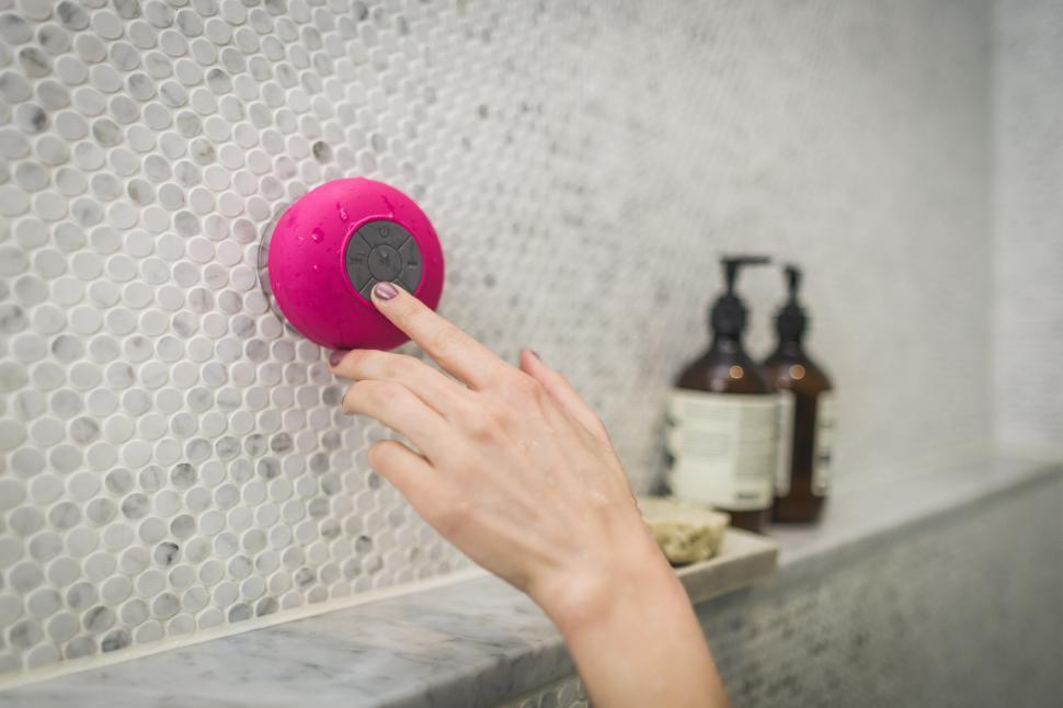Free Image of Woman Using Shower Speaker 