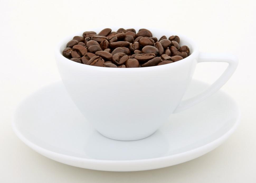 Free Image of White Cup Filled With Coffee Beans on Saucer 