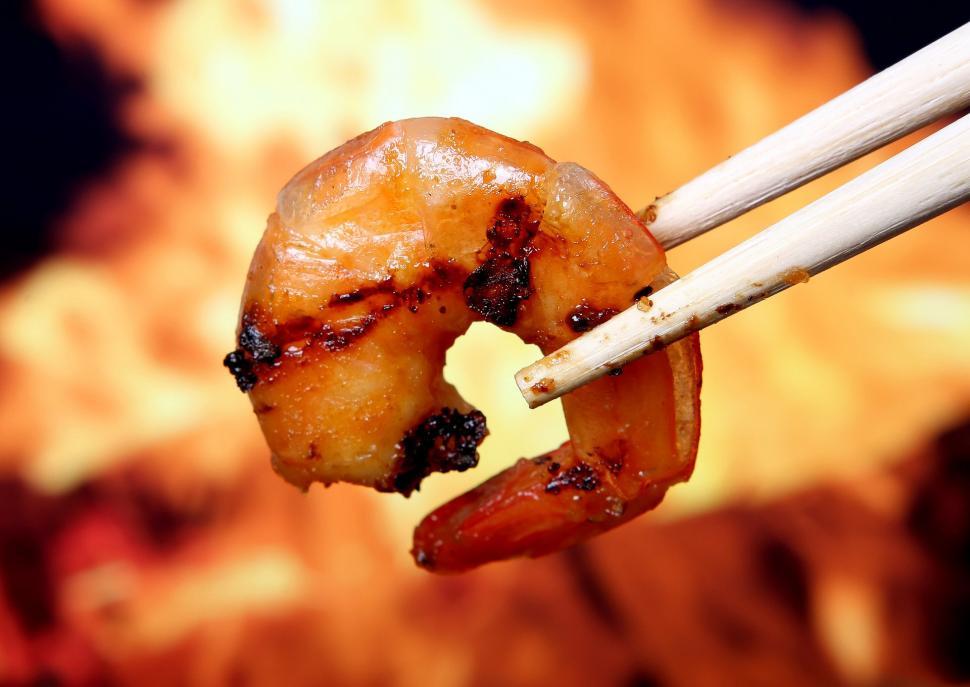 Free Image of Person Holding Chopsticks With Food 
