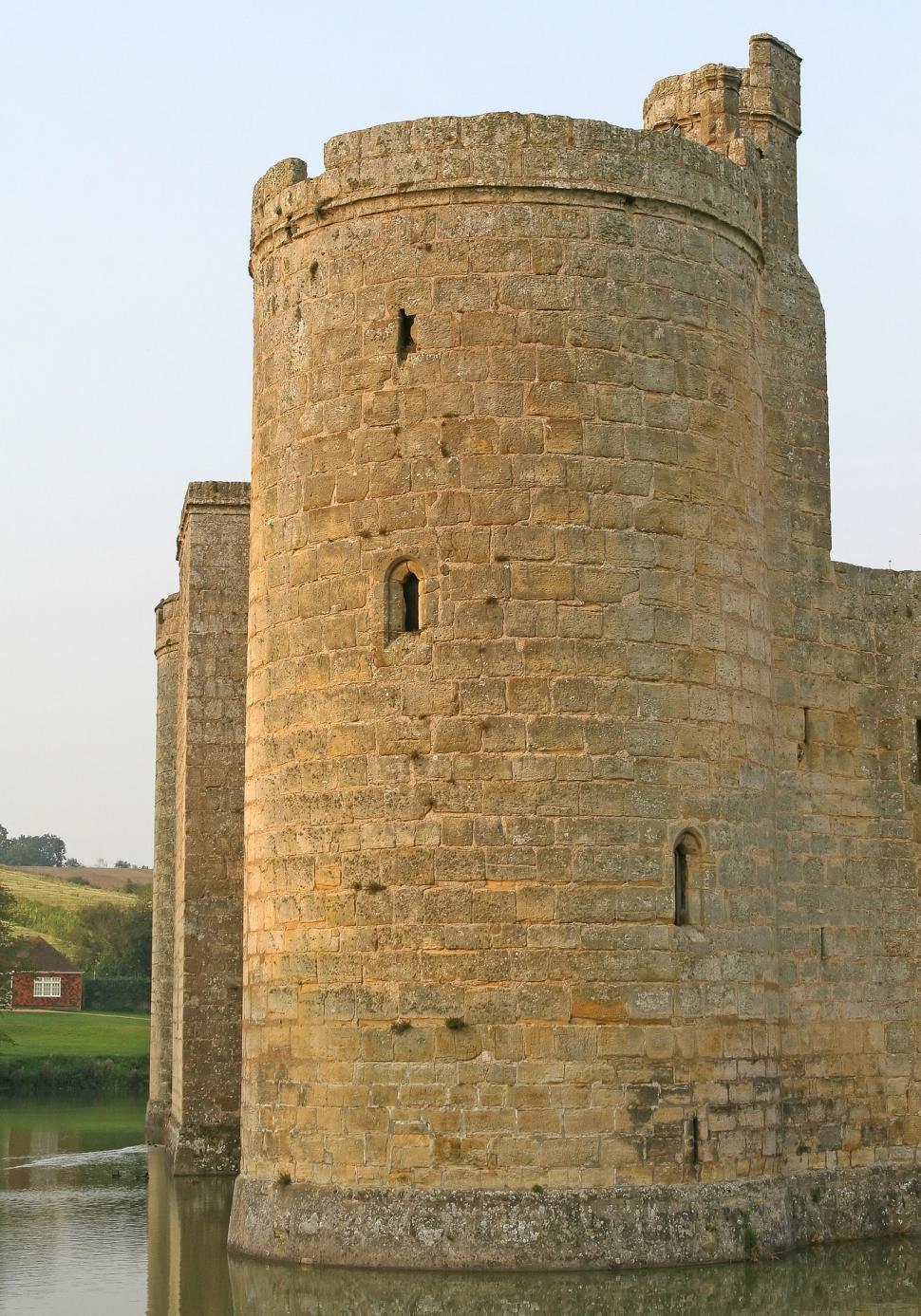 Free Image of Large Brick Tower by Water 