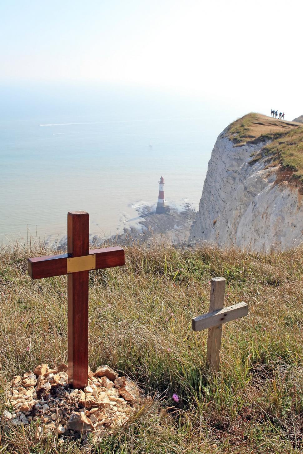 Free Image of Wooden Cross on Grass-Covered Hillside 