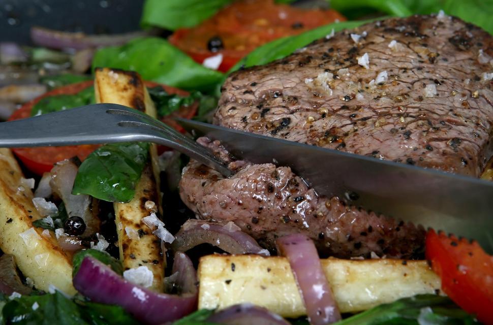 Free Image of Close Up of a Plate of Food With a Knife 
