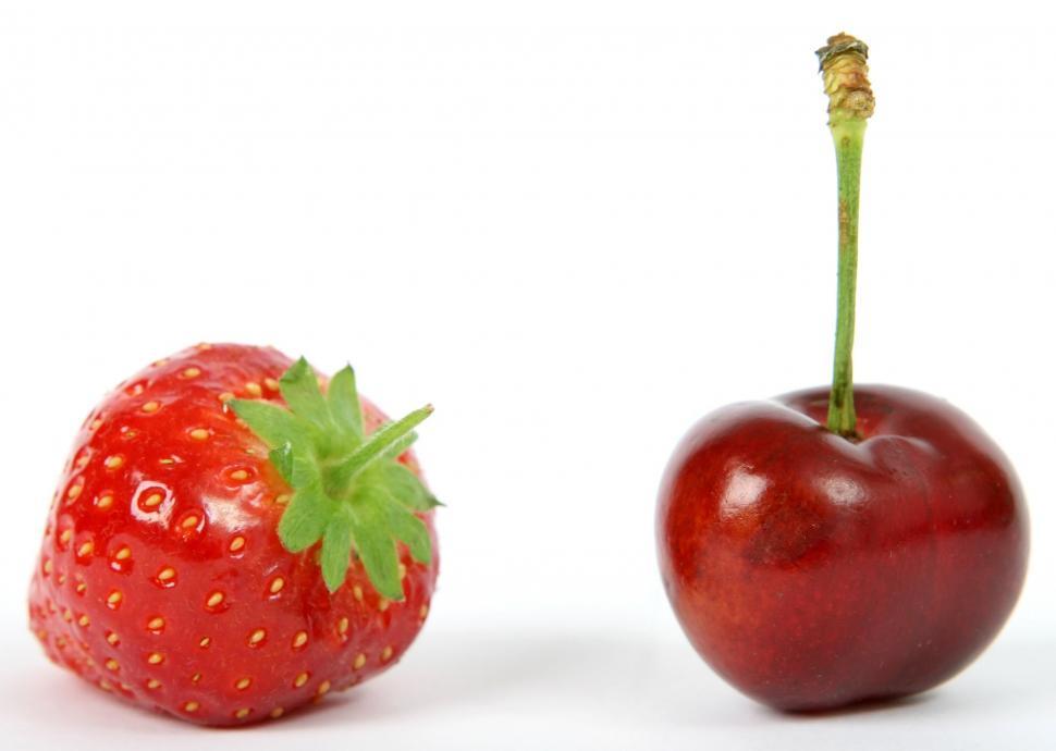 Free Image of Red Apple and Strawberry on White Background 