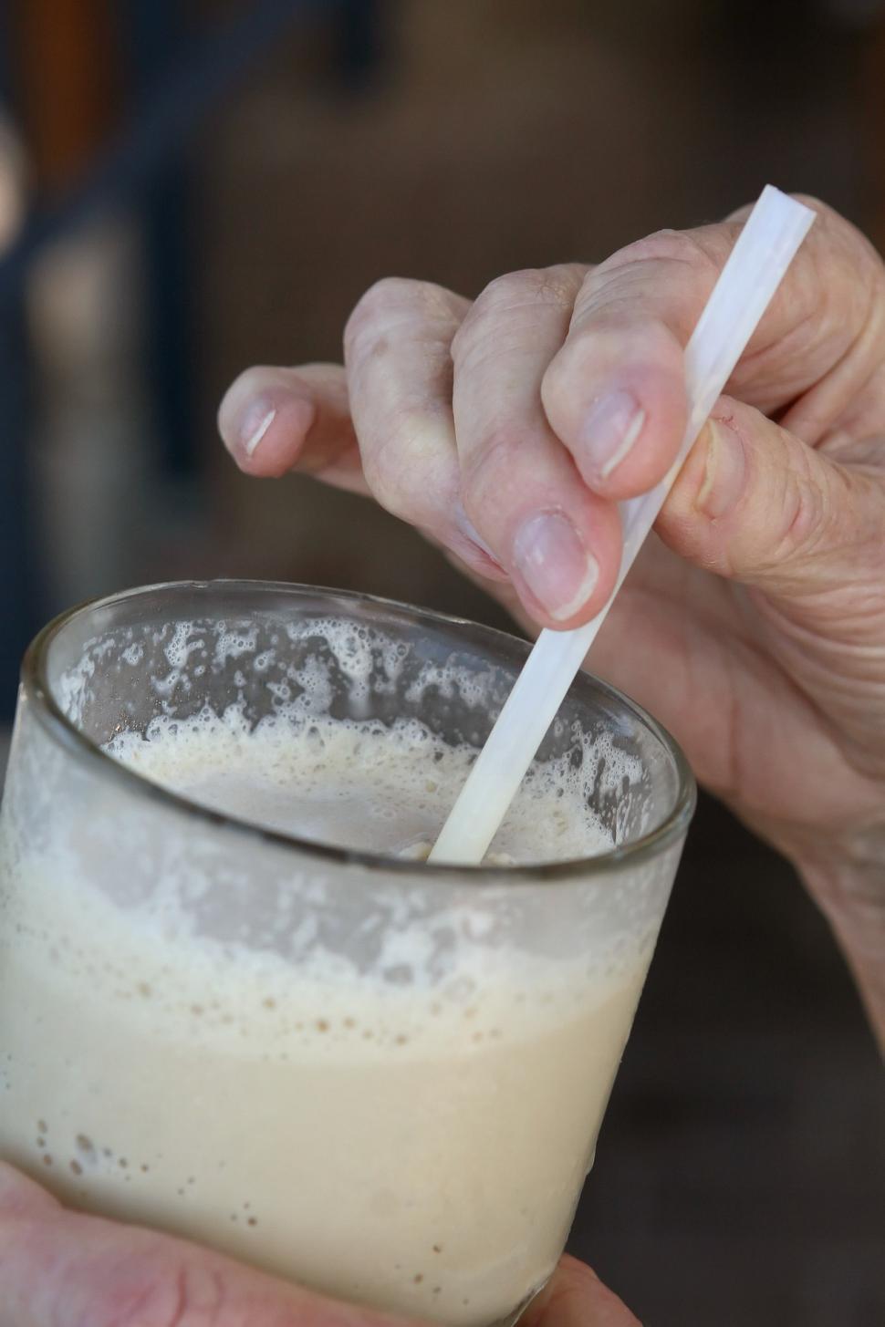 Free Image of Person Holding Cigarette in Glass 